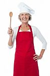 Happy Aged Chef Holding Wooden Spoon Stock Photo