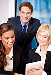 Happy Business Team At The Office Stock Photo