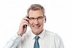 Happy Businessman Making A Call Stock Photo