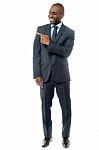 Happy Businessman Pointing At Something Stock Photo