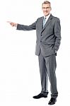 Happy Businessman Pointing On Copy Space Stock Photo