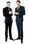 Happy Businessmen Using Cellphone Stock Photo