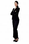 Happy Businesswoman With Folded Arms Stock Photo