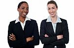 Happy Businesswomen With Arms Crossed Stock Photo