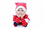 Happy Christmas Boy Laying And Smiling Stock Photo