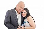 Happy Couple Holding A Box With A Ring Isolated Stock Photo