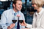 Happy Couple Toasting Red Wine Stock Photo