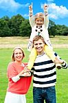 Happy Family In Park Stock Photo