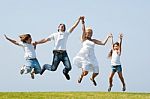 happy family Jumping Stock Photo