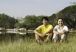 Happy Family Posing For A Portrait In The Park Stock Photo