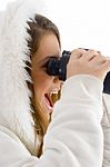 Happy Female Using Binocular To Watch Stock Photo