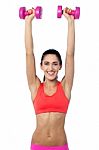 Happy Fitness Woman Lifting Dumbbells Stock Photo