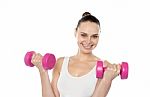 Happy Fitness Woman Lifting Dumbbells Stock Photo