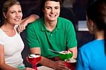 Happy Friends Enjoying Tempting Dessert Stock Photo