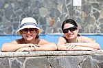 Happy Friends In The Pool. Focus In The Right Lady Stock Photo