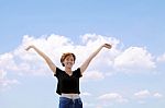 Happy Girl On Blue Sky Background Stock Photo