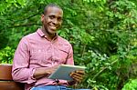 Happy Guy Using His Tablet Pc, Outdoors Stock Photo