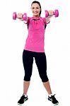 Happy Gym Woman Lifting Dumbbells Stock Photo