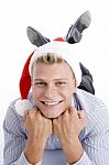 Happy Laying Man With Christmas Hat Stock Photo