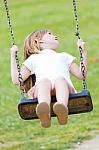 Happy Little Girl Having Fun In The Park Stock Photo