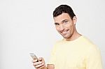 Happy Man Using Mobile Phone Stock Photo