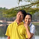 Happy Mother And Father In The Park Stock Photo