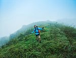 Happy People  With Arms Raised Up And  Enjoying  Beautiful Tropical Rainforest At And Beautiful Mountain Background  With  Nature Landscape Stock Photo