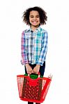 Happy School Girl Carrying Stationery In Basket Stock Photo