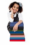 Happy School Girl With Pile Of Books Stock Photo