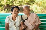 Happy Senior Couple Posing For A Selfie Stock Photo