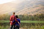 Happy Smiling Romantic Couple Relaxing In Love At The Autumn Bea Stock Photo