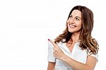 Happy Smiling Woman Showing Copyspace Stock Photo