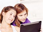 Happy Teenage Girls Using Touchpad Stock Photo