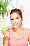 Happy Woman At Home With Fruit Stock Photo