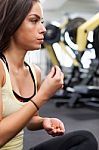 Happy Woman Having A Break From Exercising In Health Club Stock Photo