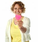 Happy Woman Offering Her Heart Stock Photo