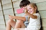 Happy Young Brothers Taking Selfies With Her Smartphone In The P Stock Photo