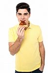 Happy Young Casual Boy Eating Pizza Stock Photo