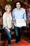 Happy Young Couple Holding Pizza Boxes Stock Photo