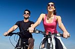 Happy Young  Couple On A Bike Ride In The Countryside Stock Photo