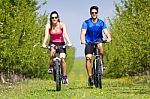 Happy Young  Couple On A Bike Ride In The Countryside Stock Photo