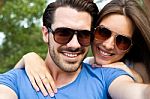 Happy Young Couple Taking Selfies With Her Smartphone In The Par Stock Photo