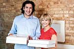 Happy Young Couple With Pizza Boxes Stock Photo