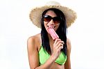 Happy Young Girl In Bikini, Eating An Strawberry Ice Cream Stock Photo