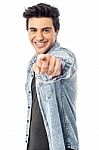 Happy Young Man Pointing At You Stock Photo