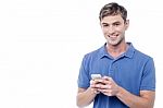 Happy Young Man Using Mobile Stock Photo