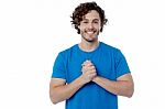 Happy Young Man With Clasped Hands Stock Photo