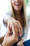 Happy Young Woman Because Her Boyfriend Gives An Engagement Ring Stock Photo