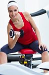 Happy Young Woman Practicing Sport In Gym Stock Photo