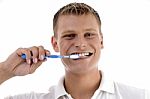 Healthy Male Cleaning His Teeth Stock Photo